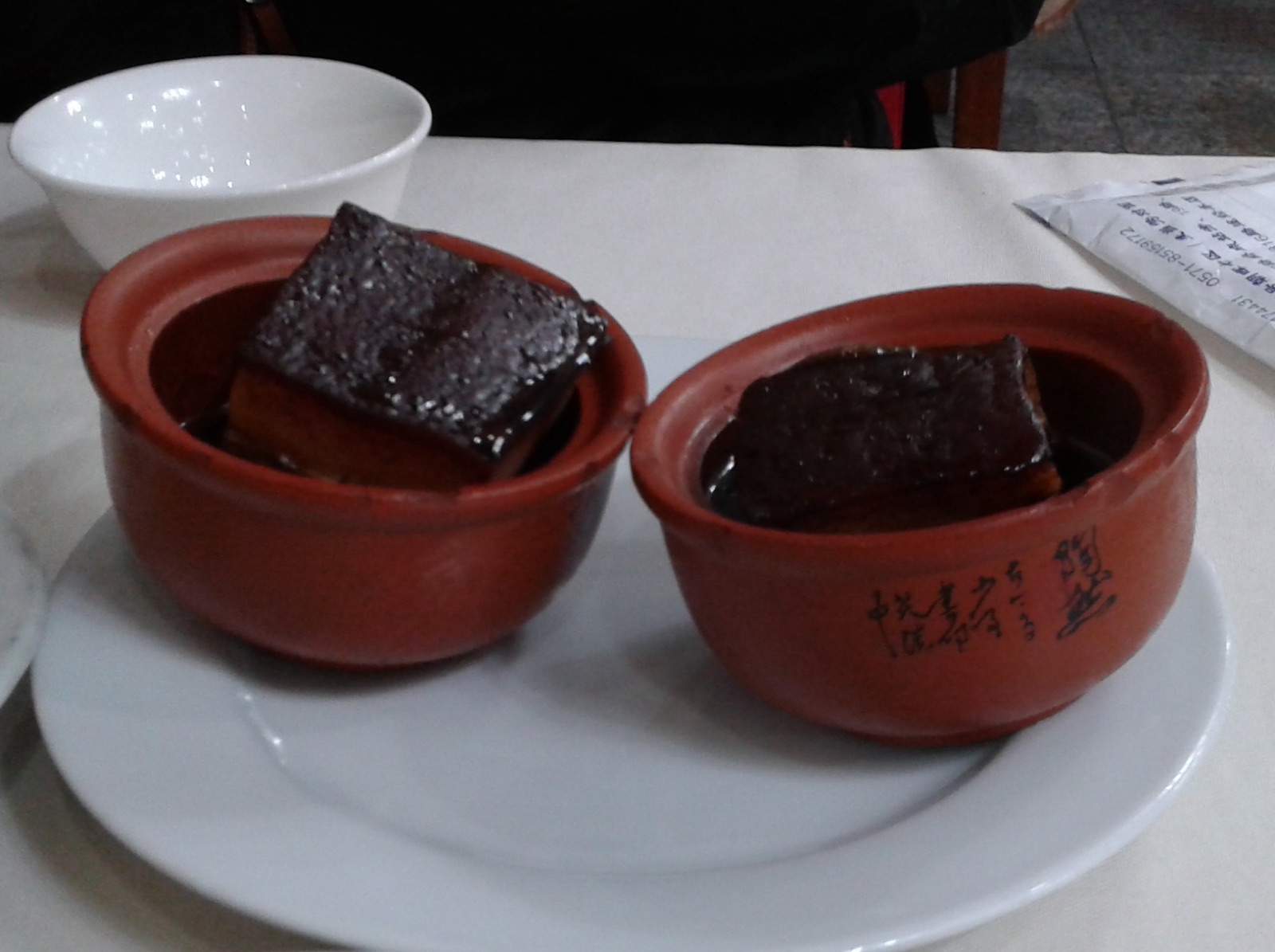 A serving of glossy Dongpo pork, a famous Hangzhou dish.