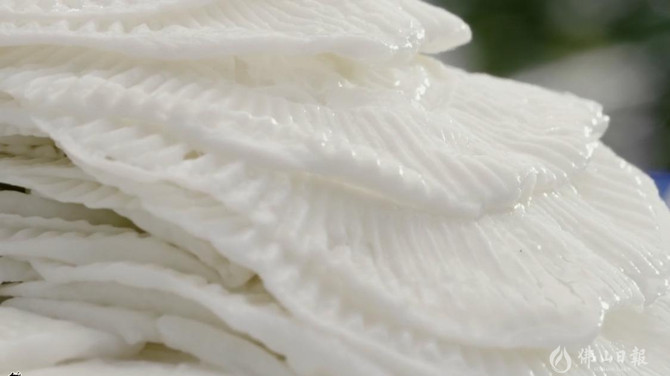 Close-up of stacked Jinbang milk chips from Shunde.