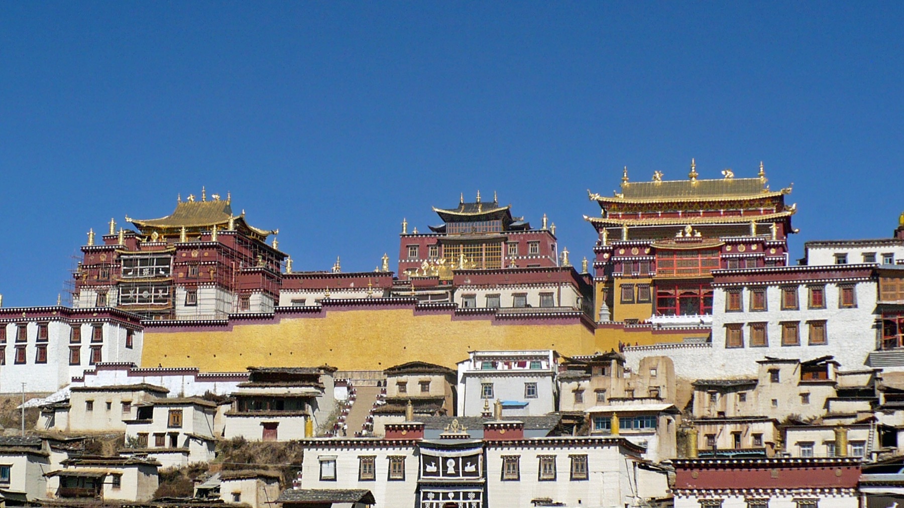 Songzanlin Monastery buildings rising on a hillside in Shangri-La, Yunnan.