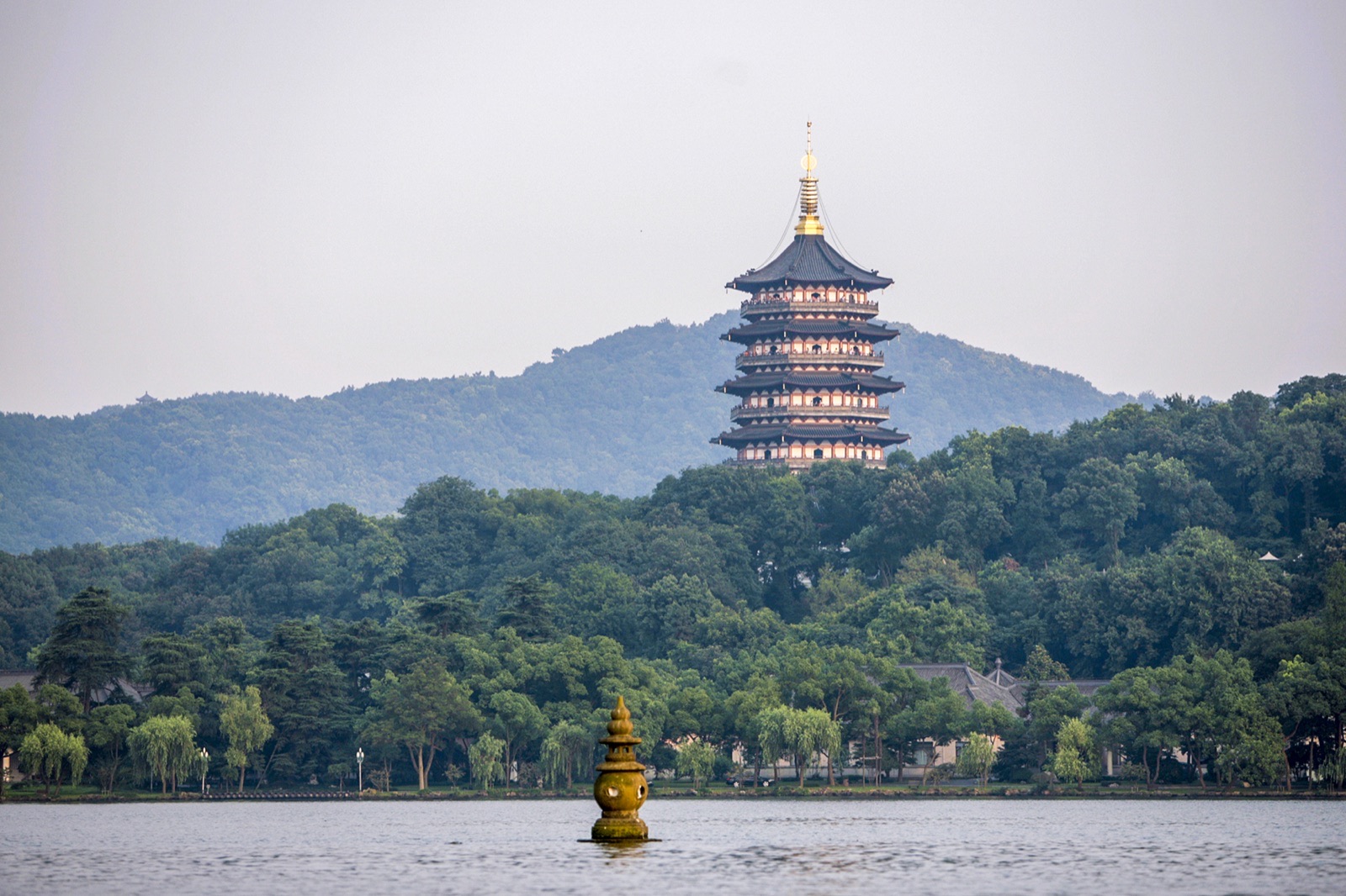 Leifeng Pagoda and West Lake shoreline in Hangzhou.