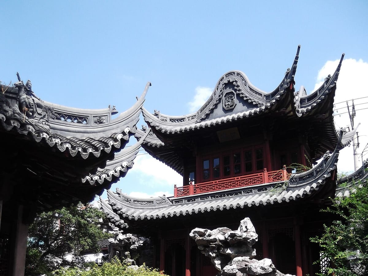 Traditional Yu Garden pavilion and pond scenery in Shanghai.