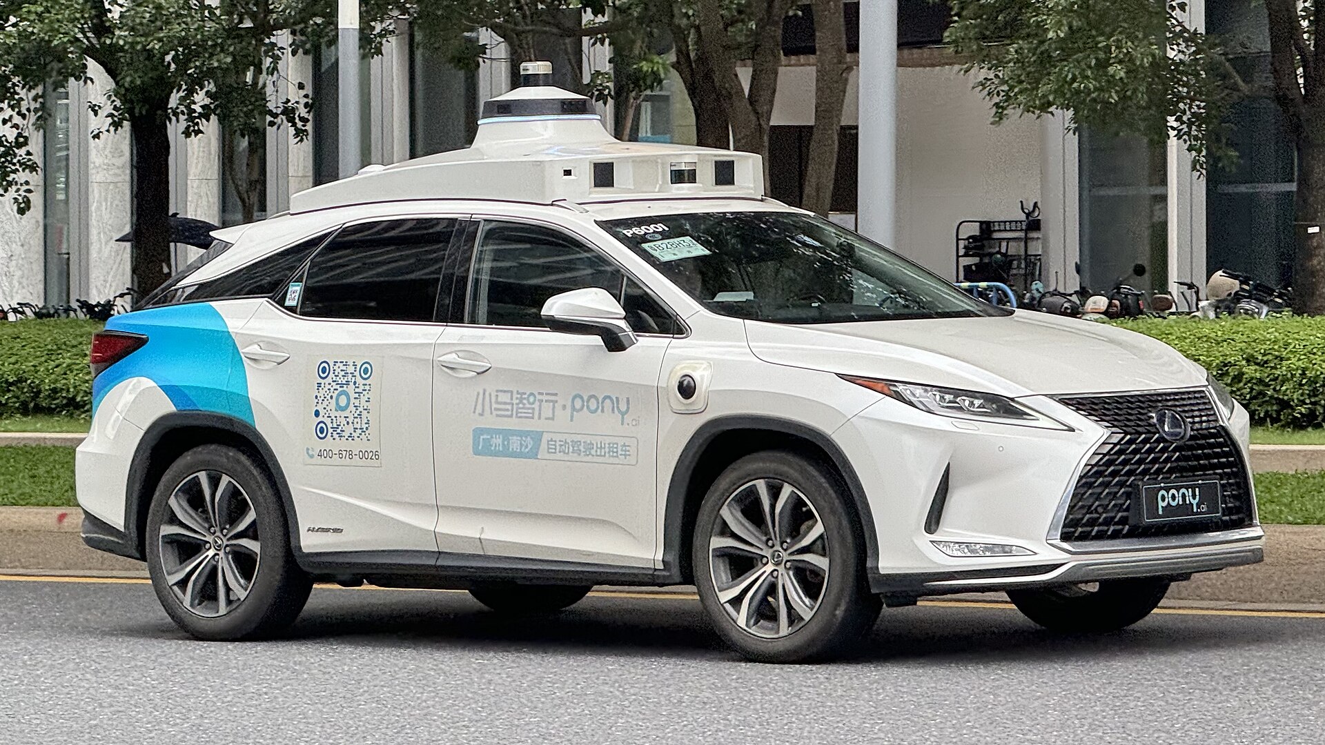 Pony.ai robotaxi with roof sensors and Shenzhen service markings.